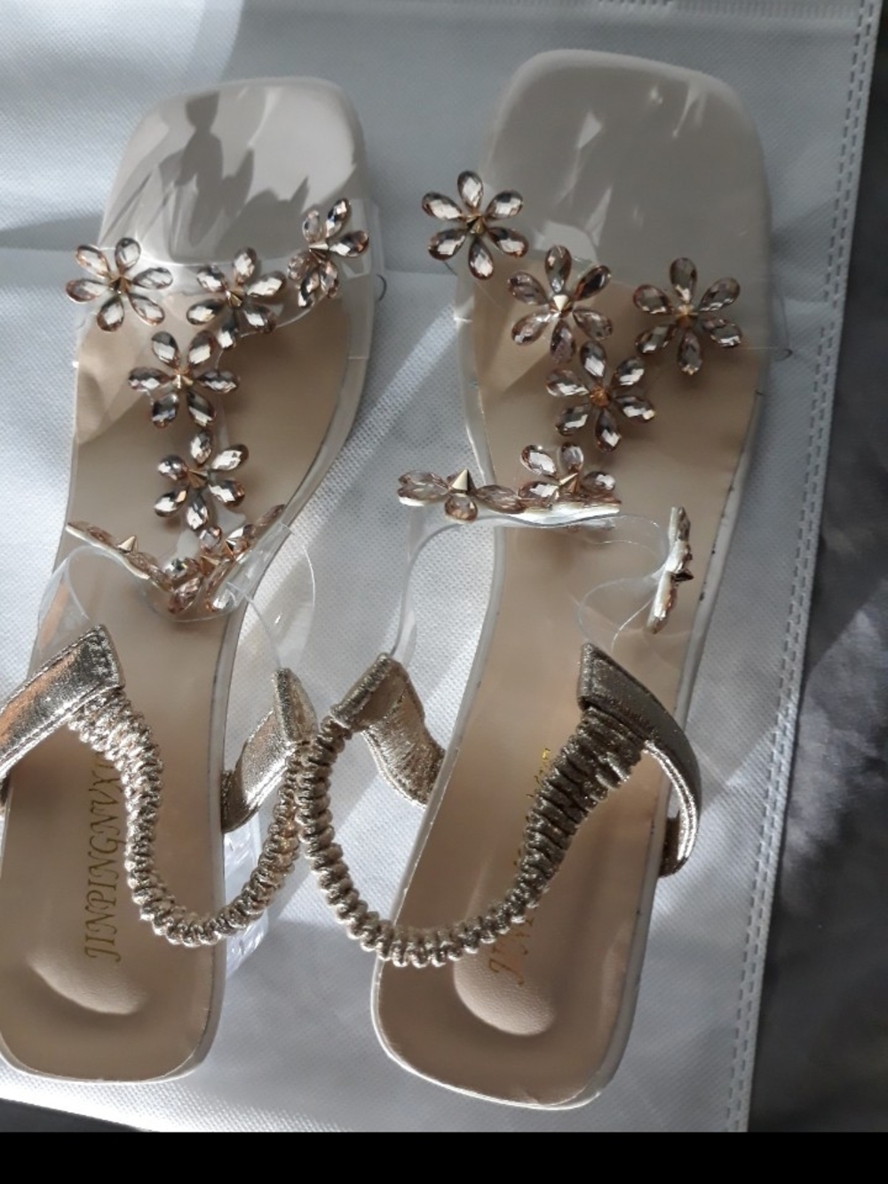 Women’s Clear Sandals with Gold Floral Accents